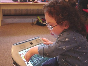 child with AAC technology